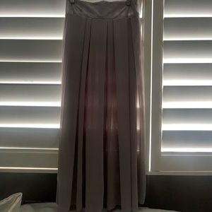 im not sure of the brand but its a long skirt that is gray and thin